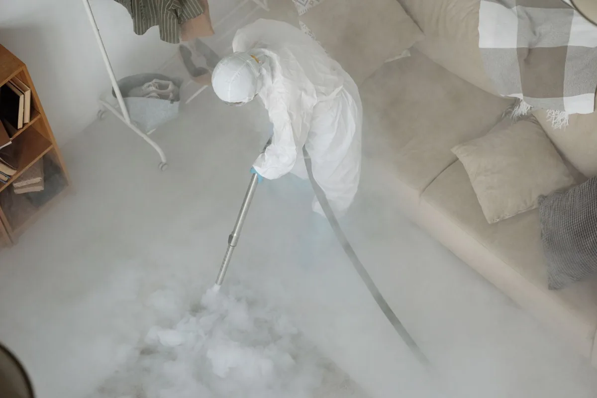 Biohazard cleanup technician in protective equipment, Orrville, OH